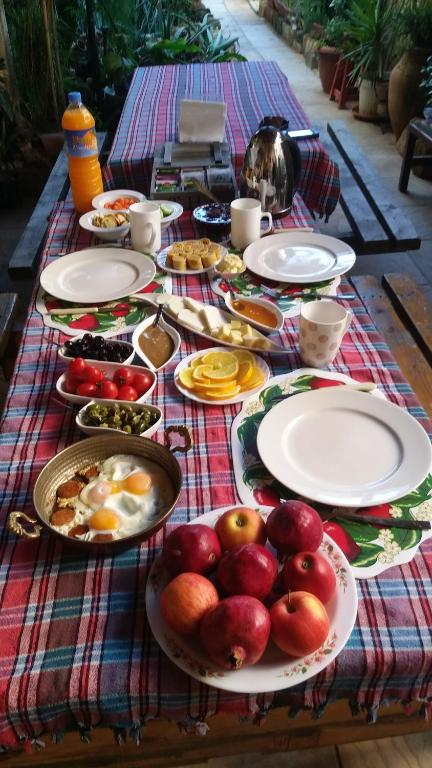 Mystery Garden breakfast spread — olives, eggs, fruit, local cheeses
