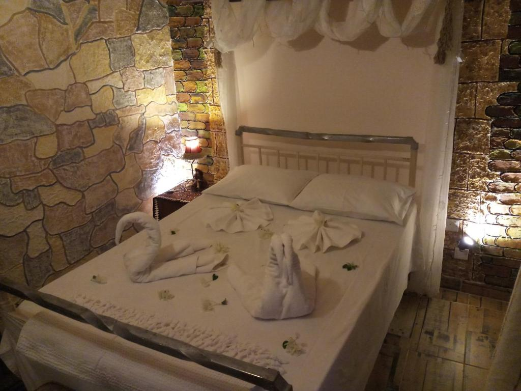 Double room with stone wall